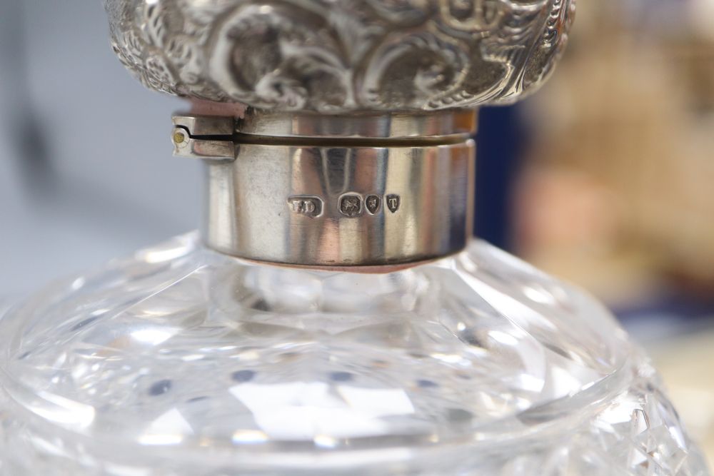 Two silver topped scent bottles, a silver christening set and napkin ring and plated sugar tongs